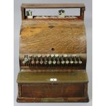 AN EARLY 20th CENTURY NATIONAL CASH REGISTER (MODEL No. 743), in grained tin & oak case (slight