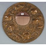 A circular wall mirror in copper embossed foliate frame, 21” diameter; together with various other