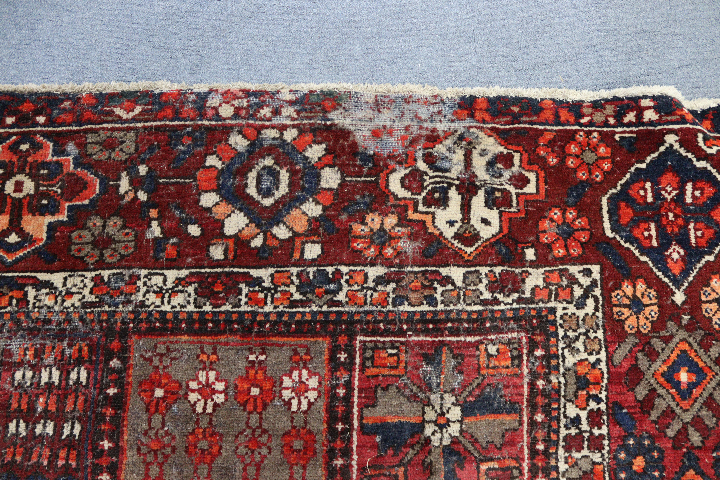 A Persian pattern carpet of crimson & deep blue ground, & with all-over repeating multi-coloured - Image 3 of 6