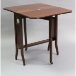 A 19th century mahogany Sutherland table with canted corners to the rectangular top, & on square