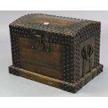 An eastern-style iron-bound dome-top travelling trunk with hinged lift-lid, & with wrought-iron side