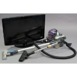 A Vax cordless slim vac; a Bush cylinder vacuum cleaner, both w.o.; & an LG 32” colour television,