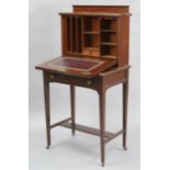 An Edwardian inlaid-mahogany small upright writing cabinet with fitted interior enclosed by hinged