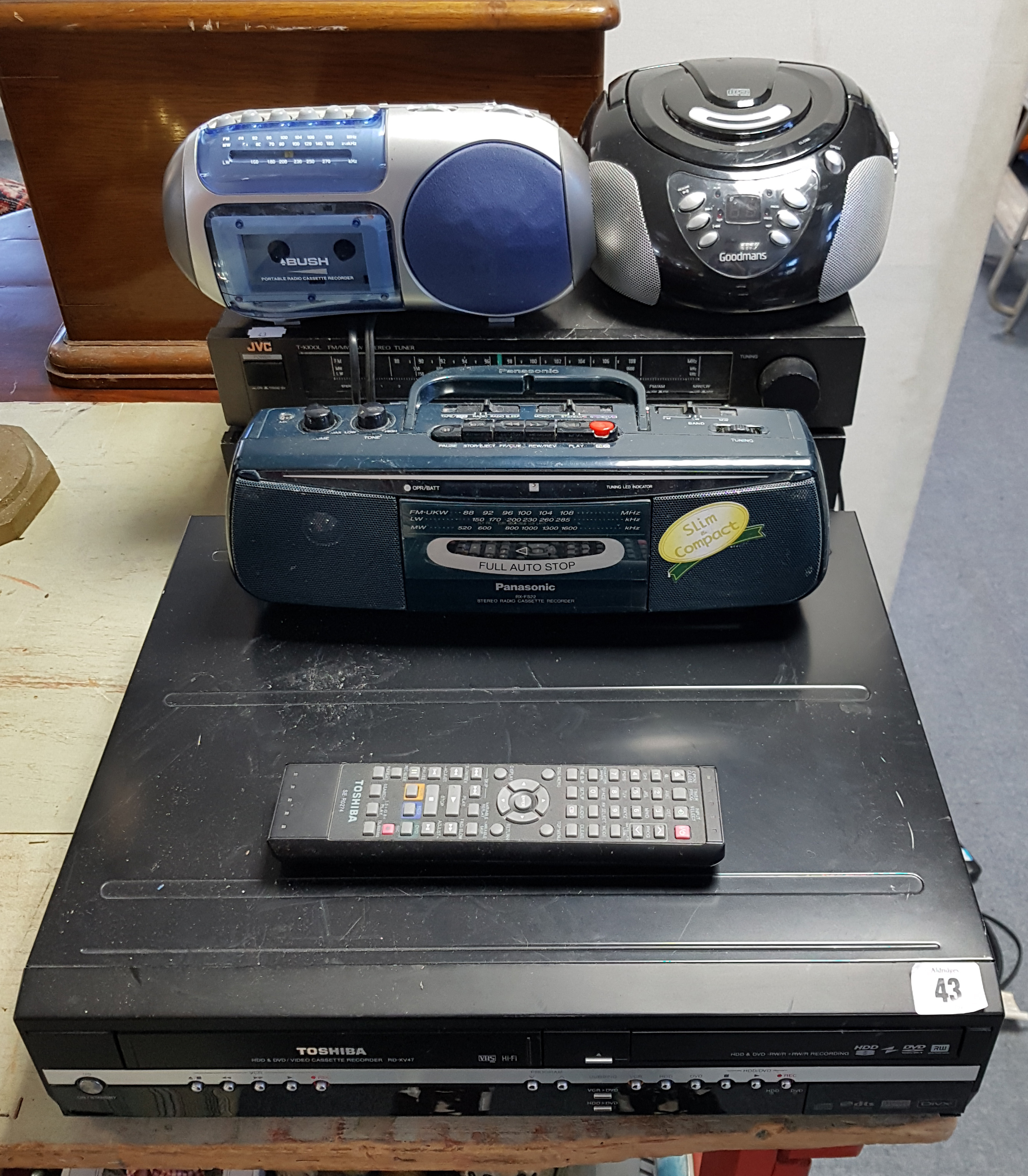 A Toshiba dvd/video cassette recorder; a JVC hi-fi system; & three various radios.