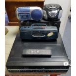 A Toshiba dvd/video cassette recorder; a JVC hi-fi system; & three various radios.