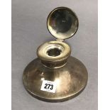 A George VI silver capstan inkwell, 5¾” diameter, Birmingham 1937; together with two silver napkin