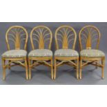 A wicker conservatory suite comprising of a circular table, 38½” diameter, four chairs; & two coffee