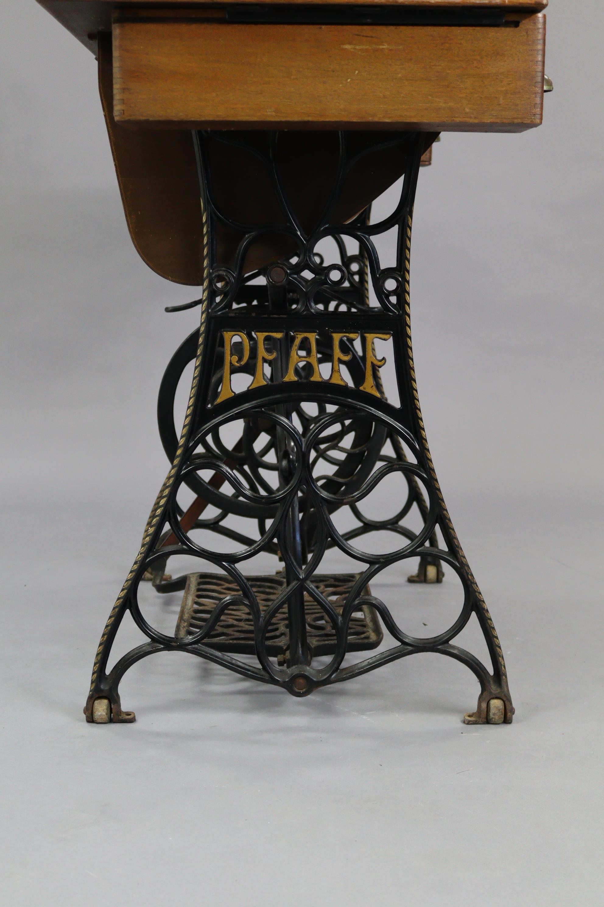 An early 20th century Pfaff treadle sewing machine in oak case, & on cast-iron stand, 37” wide. - Image 6 of 7