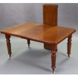 A Victorian mahogany extending dining table with moulded edge to the rectangular top, wind-out