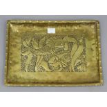 A Newlyn-type brass rectangular tray with raised fish design to centre, 10½” x 14¾”.