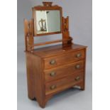 A late Victorian walnut dressing chest with rectangular swing mirror to the stage back, & fitted