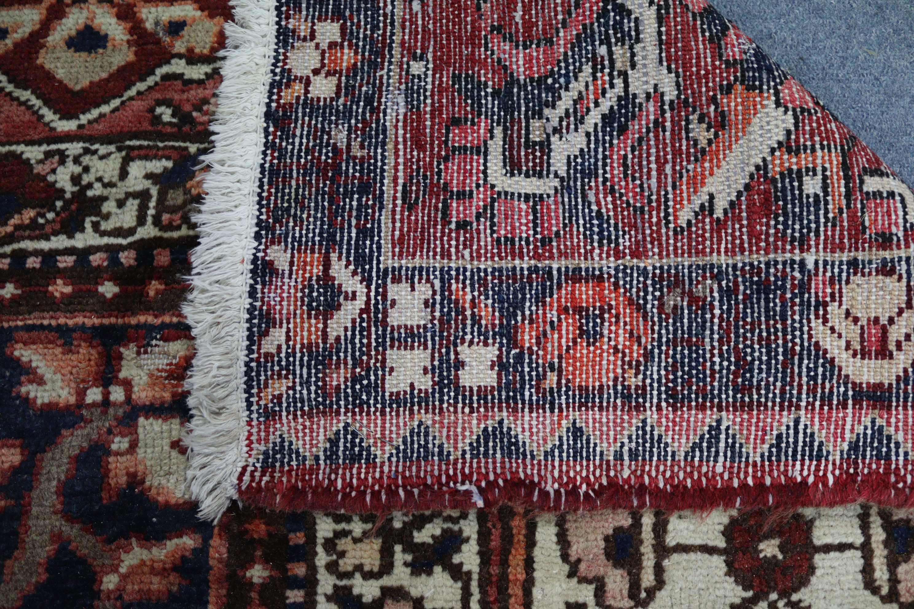 A Persian pattern carpet of crimson & deep blue ground, & with all-over repeating multi-coloured - Image 6 of 6