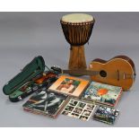 A Skylark child’s violin & bow, cased; a six-string acoustic guitar; a drum; & approximately