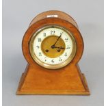 An Edwardian mantel clock with white enamel & gilt-metal two part dial & in walnut case, 10” high;