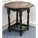 A late 19th/early 20th century oak centre table with carved decoration to the octagonal top, & on