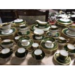 Two Aynsley bone china green and gilt part dinner/tea services of similar designs comprising a 60