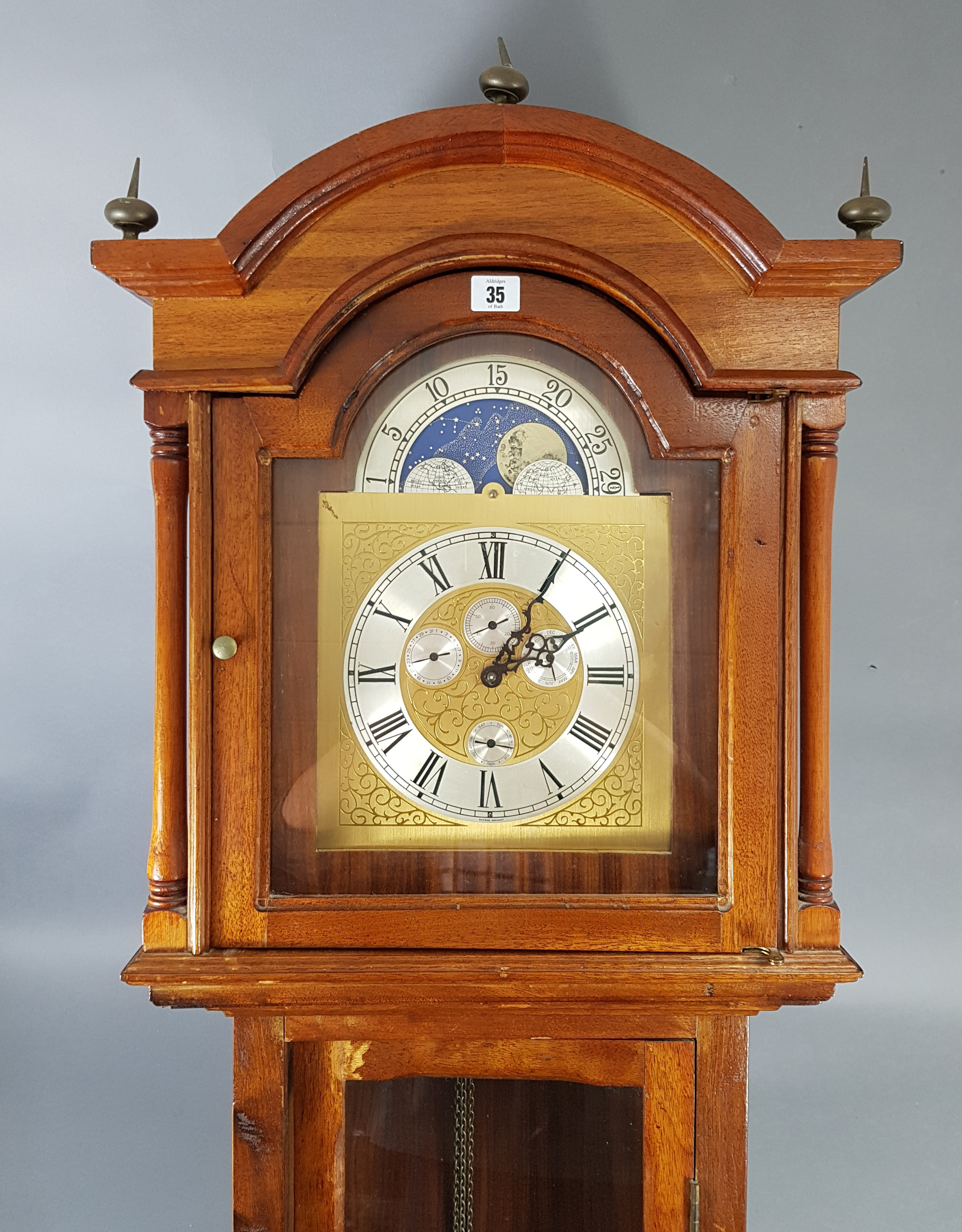 A reproduction West German longcase clock with moon phase dial, & in mahogany – finish case, 81”