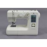A Janome electric sewing machine with case, w.o.