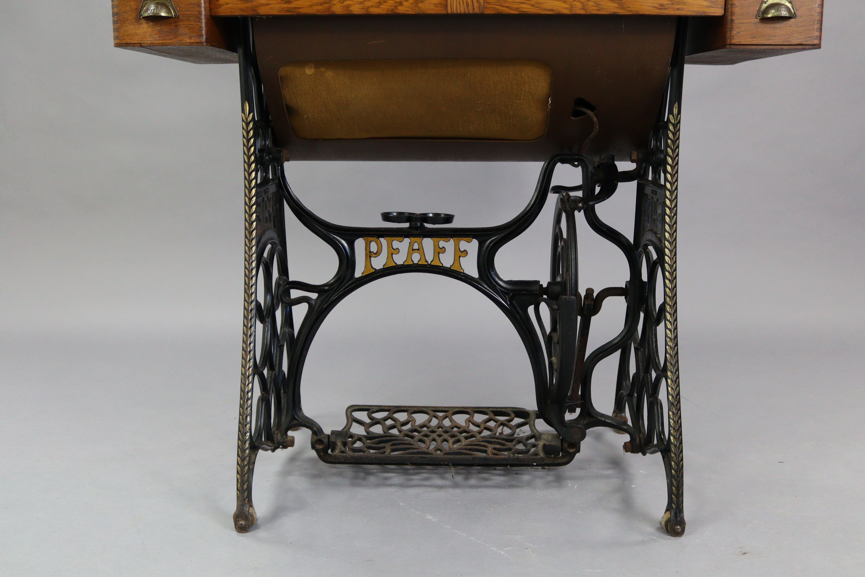 An early 20th century Pfaff treadle sewing machine in oak case, & on cast-iron stand, 37” wide. - Image 5 of 7