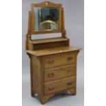 A mid-20th century oak dressing chest with rectangular swing mirror to the stage back and fitted