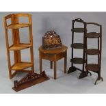 Two Edwardian folding cake stands; together with an oak needlework table; a pine fold-away corner