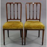 A pair of Edwardian satinwood – inlaid mahogany rail-back occasional chairs with padded seats & on