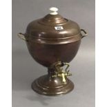 A copper samovar with brass fittings, 14” high.