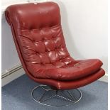 A buttoned crimson leatherette swivel easy chair on silvered-metal circular base w.a.f.