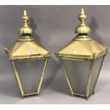 A pair of brass exterior lanterns each of square tapered form, 26” high, & with black painted