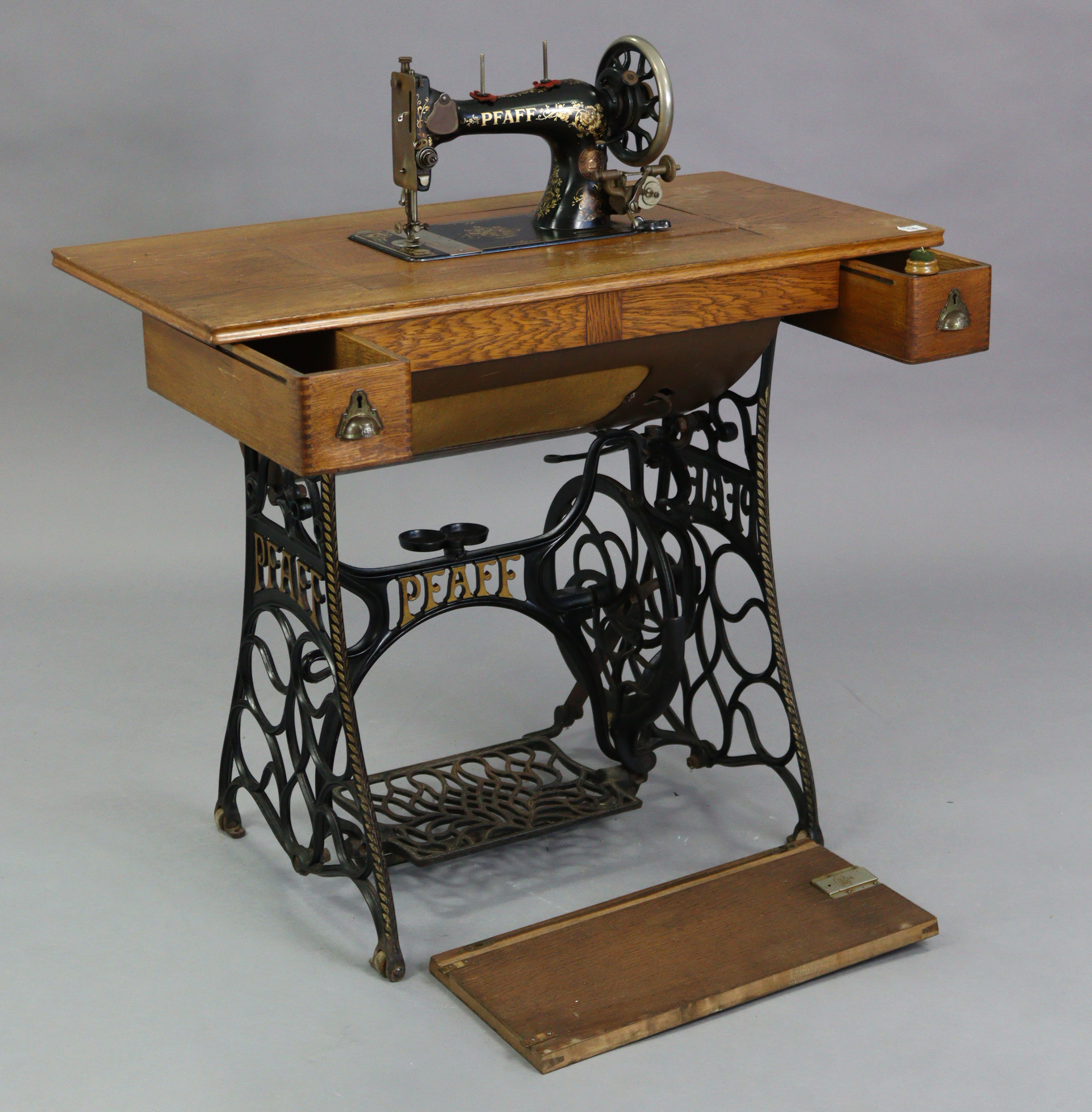 An early 20th century Pfaff treadle sewing machine in oak case, & on cast-iron stand, 37” wide. - Image 2 of 7