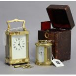A small carriage clock in brass oval case, 3¾” high; together with another brass carriage clock, 4¾”
