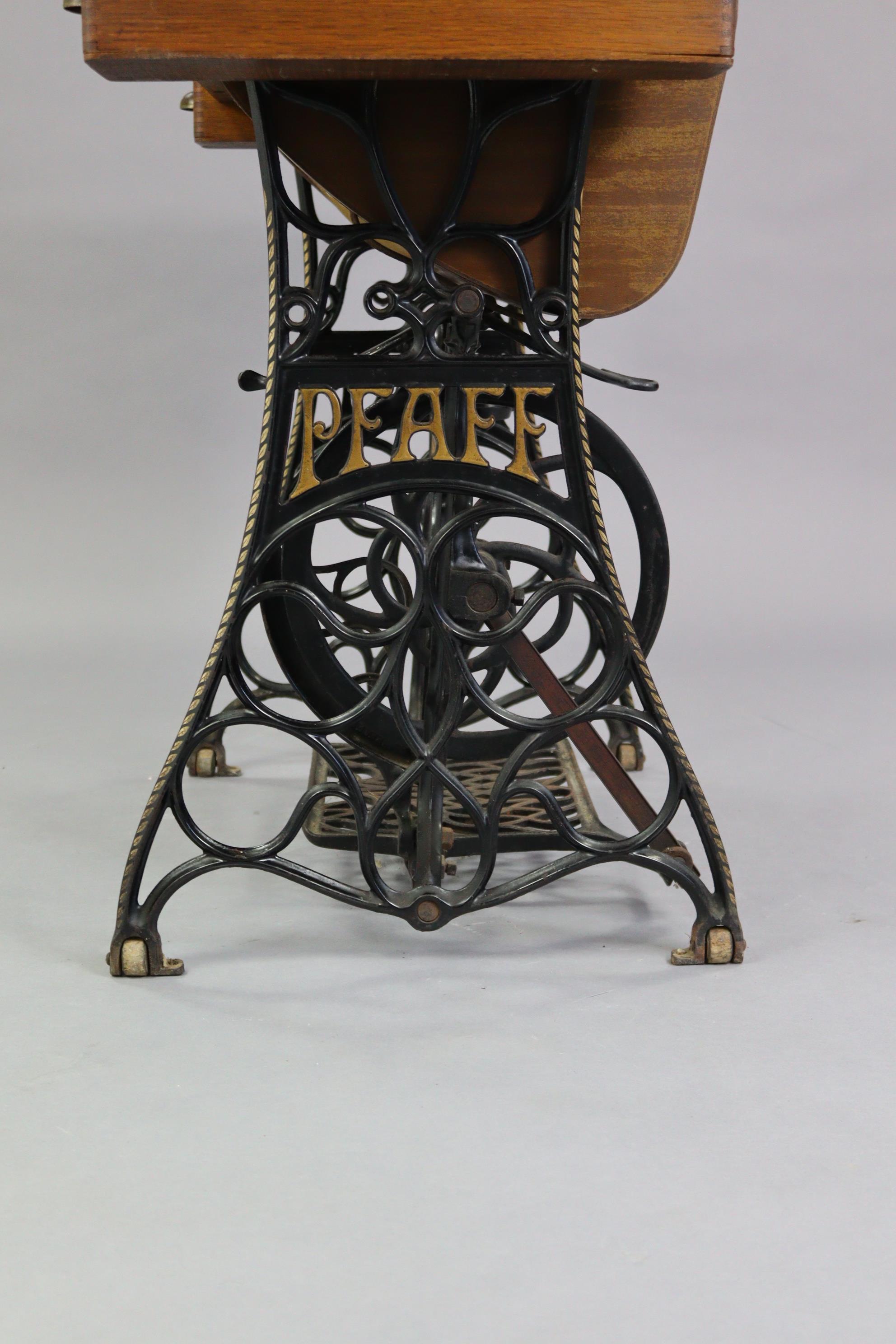 An early 20th century Pfaff treadle sewing machine in oak case, & on cast-iron stand, 37” wide. - Image 7 of 7