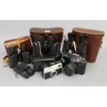 Four pairs of binoculars (three with cases); together with a Samsung “34 x optical zoom” digital