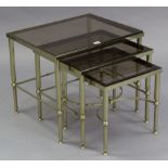A reproduction nest of three brass rectangular occasional tables; together with a large