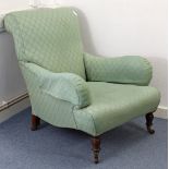 A LATE VICTORIAN EASY CHAIR in the Howard & Sons style with shaped back & sprung seat upholstered