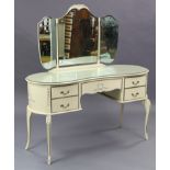 A continental-style cream-finish bedroom pair comprising of a kidney-shaped dressing table, 51½”