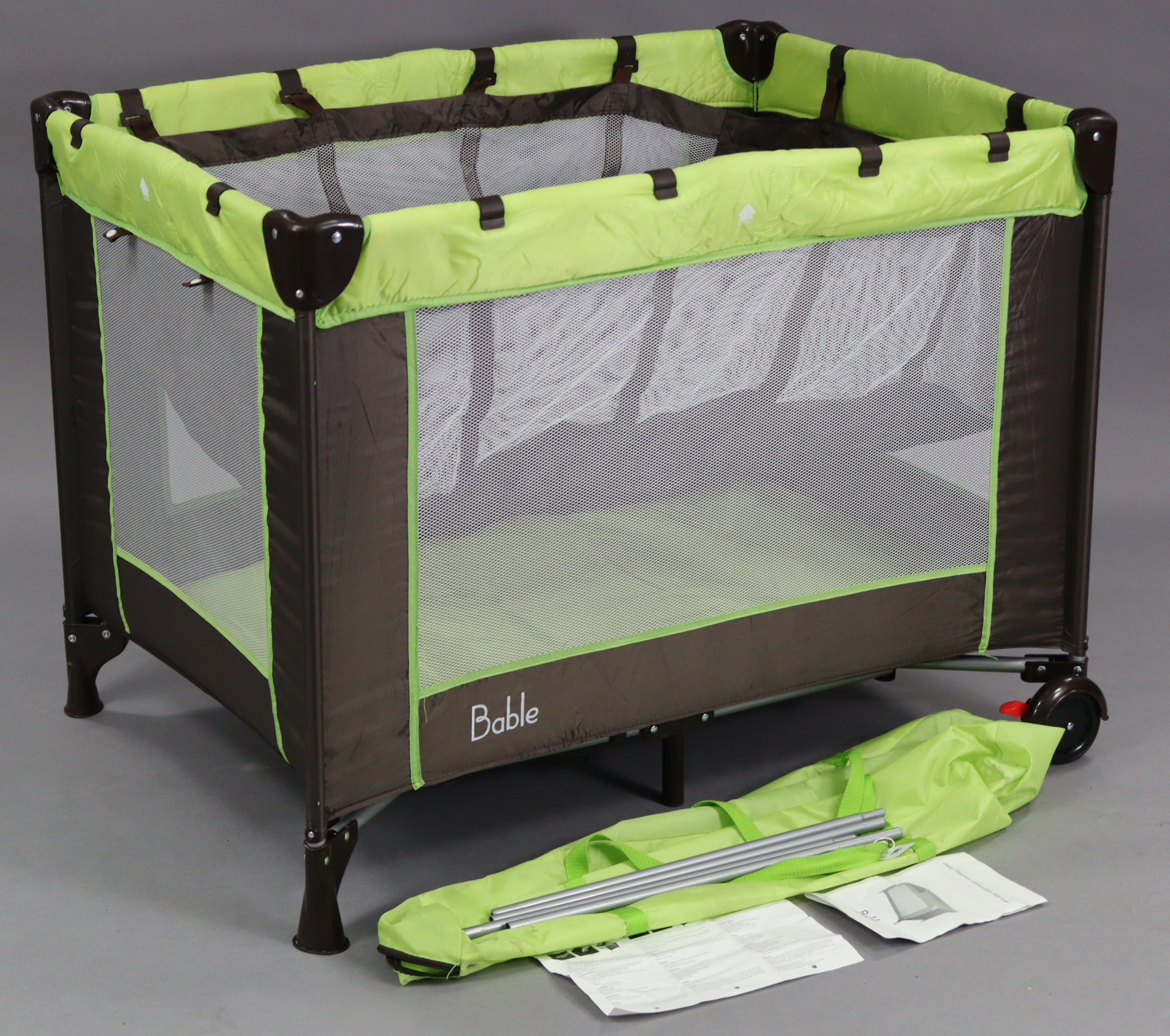 A Bable travel cot/playpen, with case.