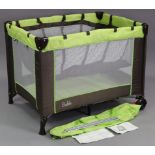 A Bable travel cot/playpen, with case.