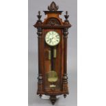 A 19th century Vienna-type regulator wall clock with eight-day movement striking on a coiled gong,