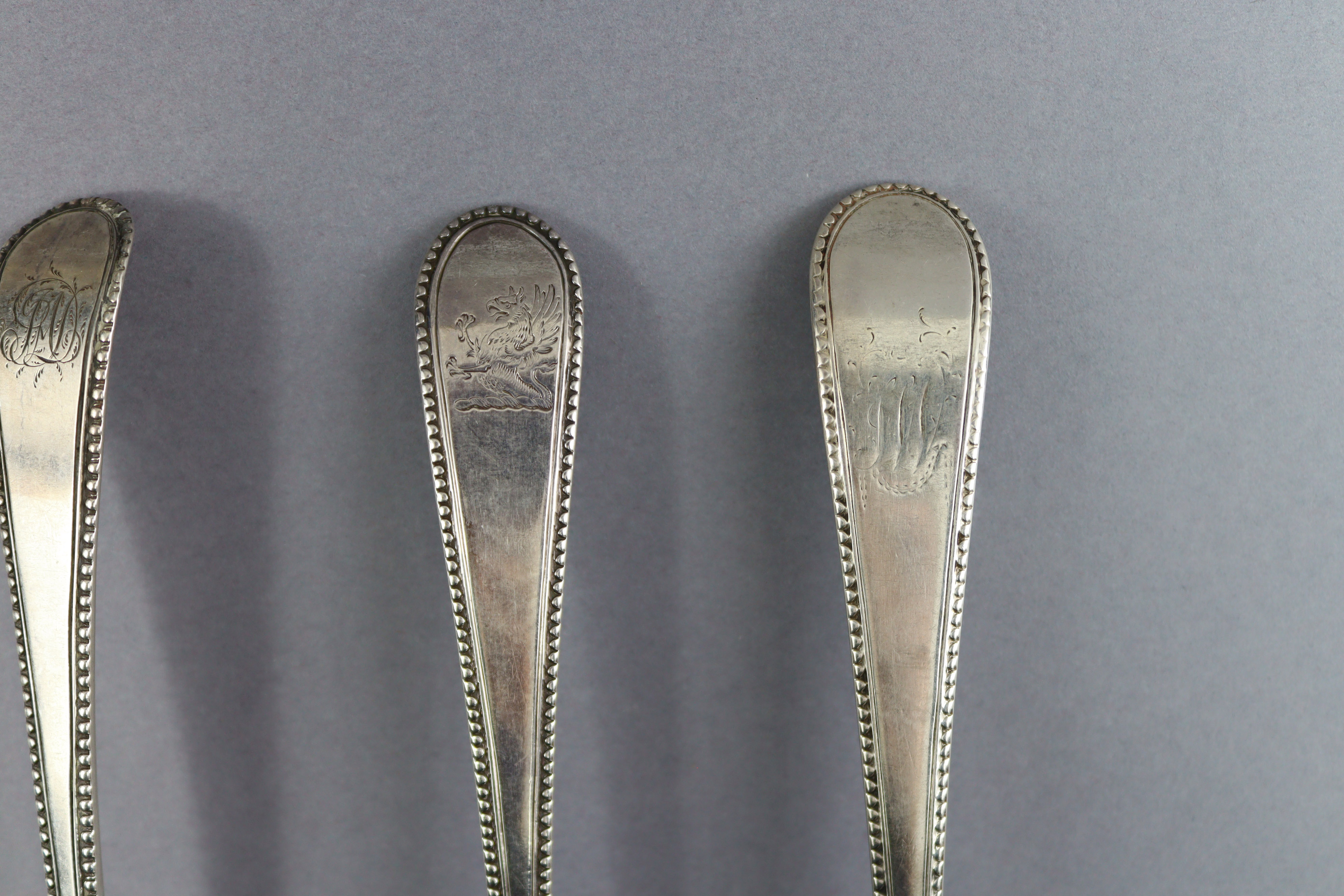 Eight George III silver Old English Bead pattern table spoons; London 1777 by Thos. Northcote, two - Image 6 of 7