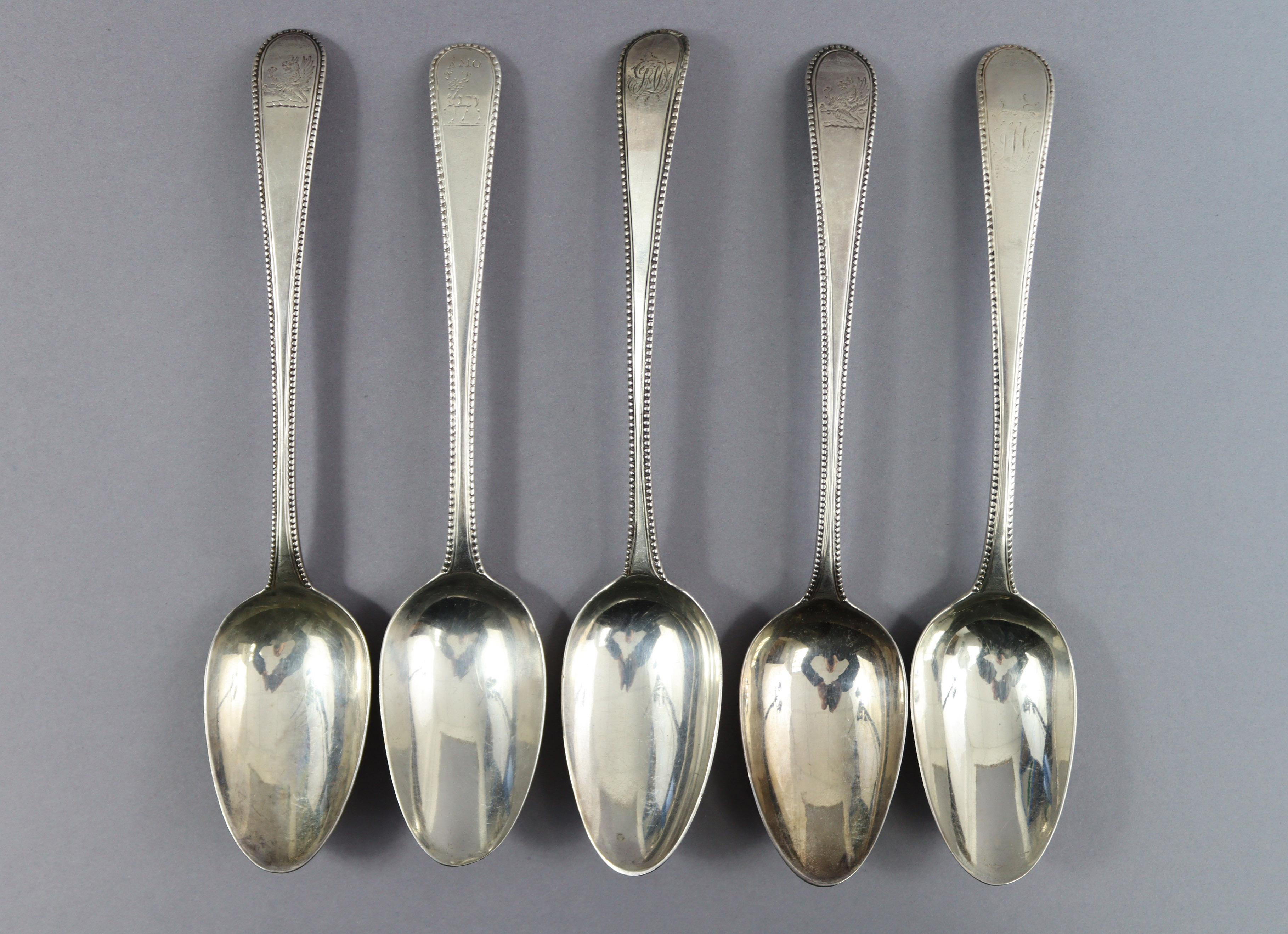 Eight George III silver Old English Bead pattern table spoons; London 1777 by Thos. Northcote, two - Image 4 of 7