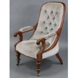 An early Victorian mahogany spoon back armchair upholstered light grey velour, with buttoned back,