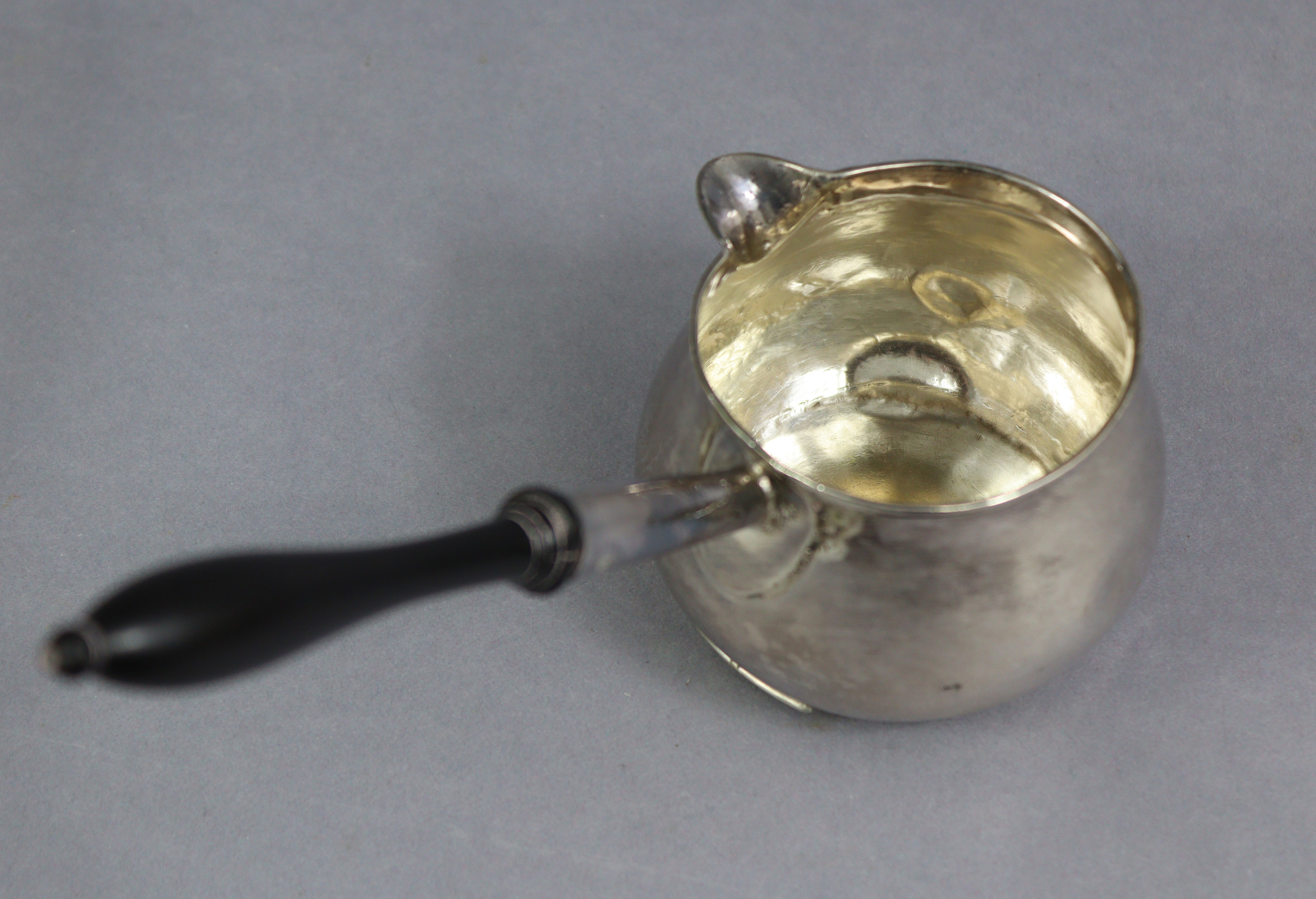 A George I silver brandy saucepan of baluster shape, with ebonised turned wood handle, 6¾” long; - Image 5 of 7
