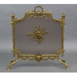 A Louis XVI style gilt-brass fire guard, the mesh panel centred by bagpipes & a quiver of arrows;