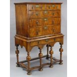 A QUEEN ANNE WALNUT CHEST-ON-STAND, the upper part with quarter-veneered top & sides, fitted two