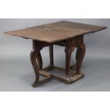 An antique French joined oak & elm provincial gate-leg table with rectangular top, fitted frieze