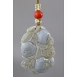 An early 20th century Chinese lavender jade pendant, carved & pierced in the form of three fruit