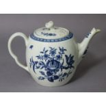 An 18th century Worcester porcelain barrel-shaped teapot with blue transfer “Rose-Centred Spray”