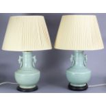 A pair of 20th century Chinese porcelain celadon-glazed vases, converted to table lamps, each with