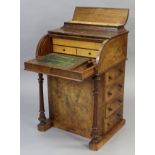A Victorian inlaid burr-walnut davenport with hinged stationery compartment above a cylinder-front